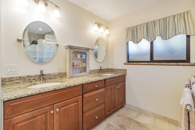 bathroom with vanity and tile patterned flooring