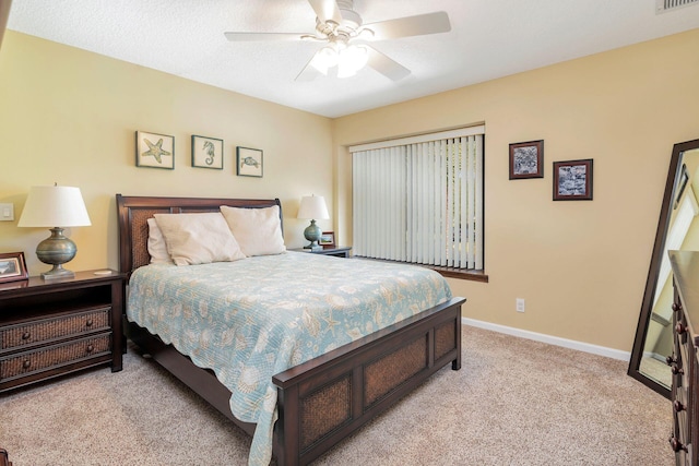 bedroom featuring ceiling fan and light carpet