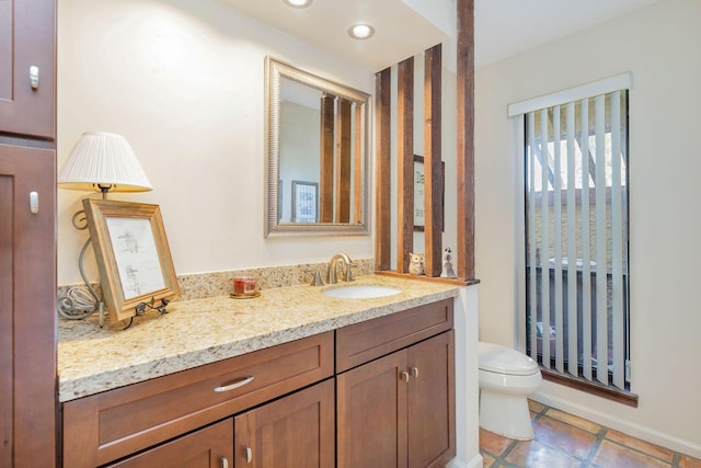 bathroom with vanity and toilet