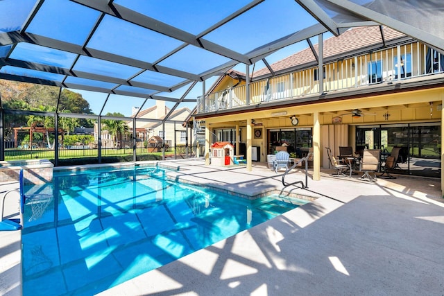 view of pool featuring a lanai, ceiling fan, and a patio area