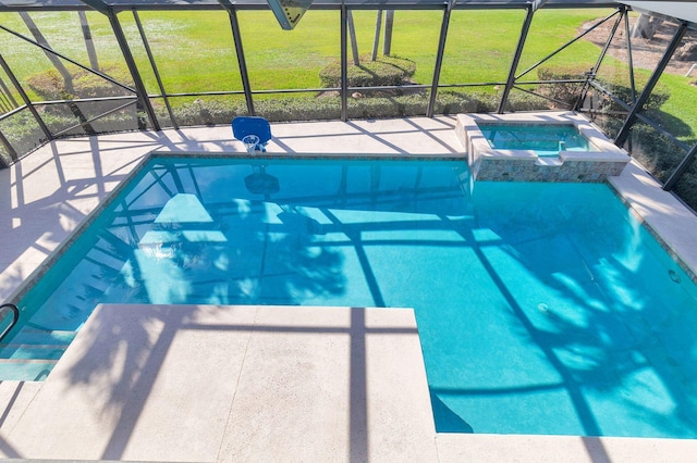 view of pool with an in ground hot tub, a lanai, and a lawn