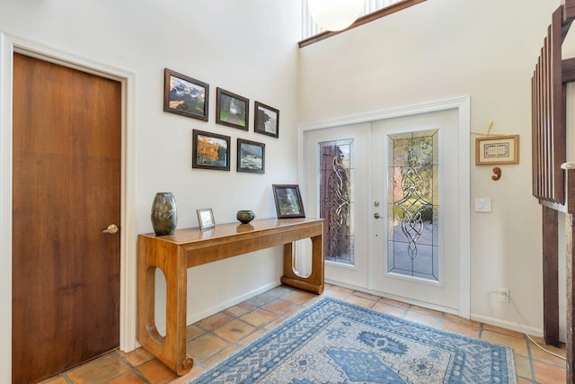 tiled foyer entrance with a wealth of natural light and french doors