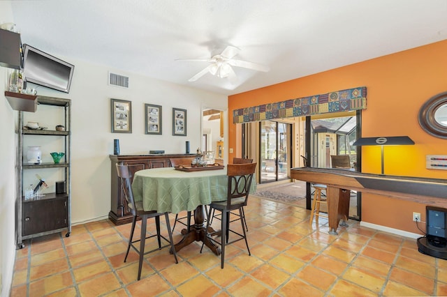 dining area with light tile patterned floors and ceiling fan