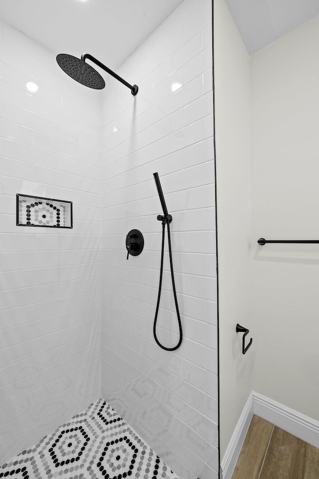 bathroom with a tile shower