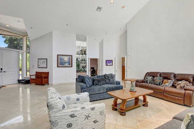 living room with a towering ceiling