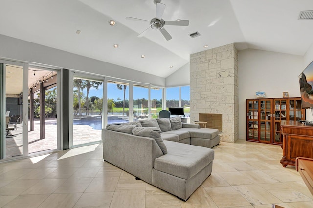 living room with ceiling fan and high vaulted ceiling