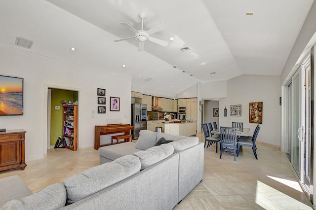 tiled living room featuring lofted ceiling and ceiling fan