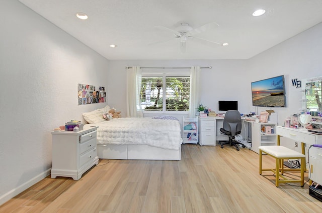 bedroom with ceiling fan and light hardwood / wood-style floors