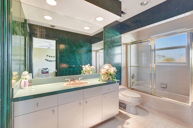 full bathroom with toilet, vanity, shower / bath combination with glass door, and tile patterned flooring