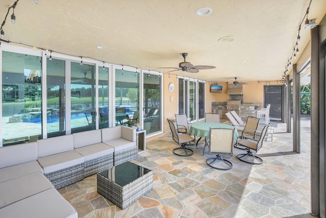 view of patio / terrace featuring ceiling fan, outdoor lounge area, and exterior kitchen