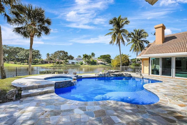 view of swimming pool featuring an in ground hot tub, a water view, pool water feature, and a patio