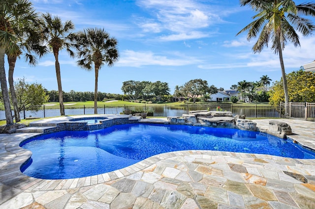 view of pool featuring an in ground hot tub, a water view, pool water feature, and a patio