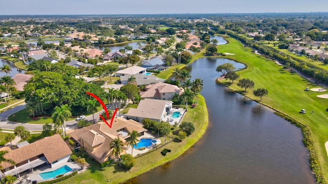 birds eye view of property with a water view