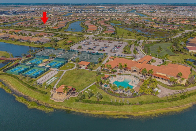 birds eye view of property with a water view