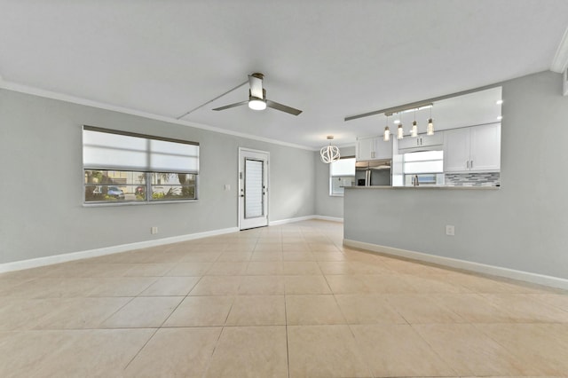 interior space featuring ornamental molding and ceiling fan