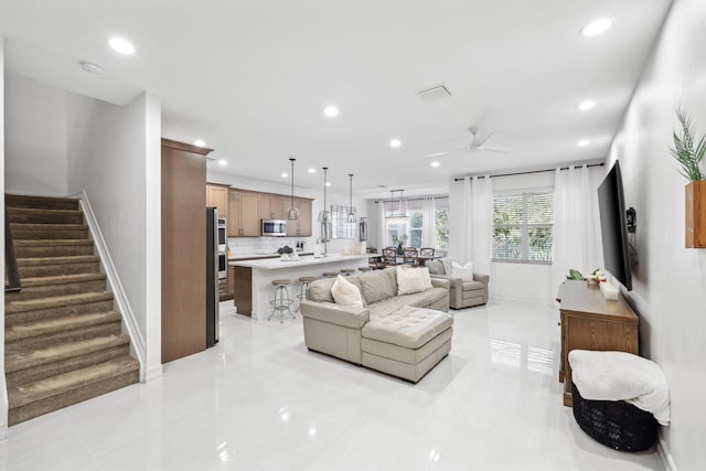 living room with ceiling fan