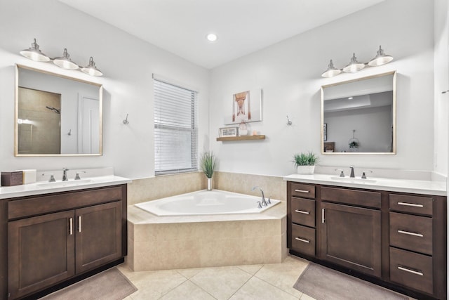 bathroom featuring tile patterned floors, independent shower and bath, and vanity