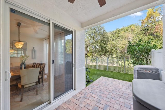 view of patio / terrace featuring ceiling fan