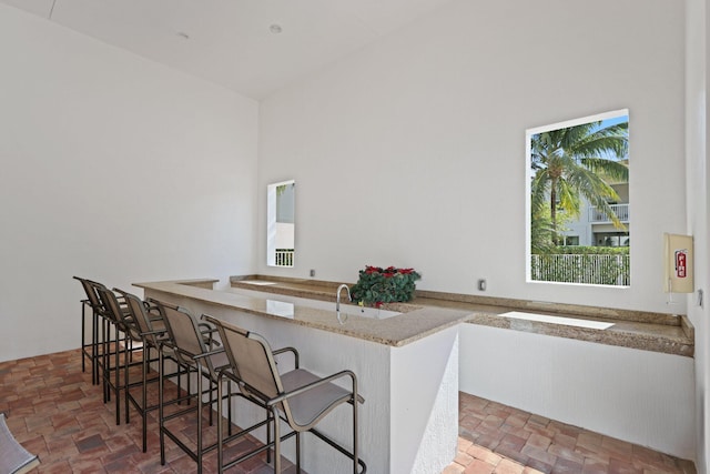 kitchen featuring a kitchen breakfast bar and kitchen peninsula