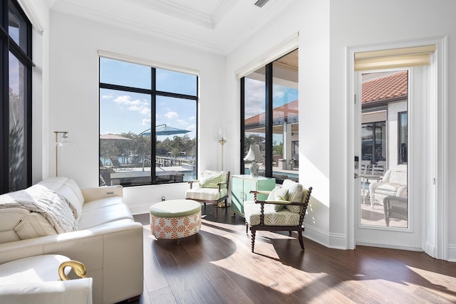 living room with crown molding and hardwood / wood-style flooring