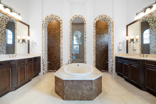 bathroom featuring tile patterned flooring, vanity, and independent shower and bath