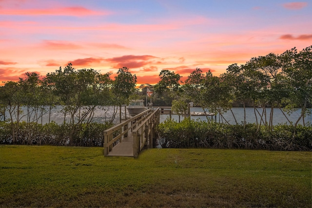 yard at dusk with a water view