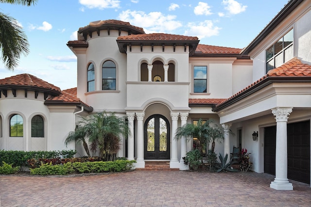 mediterranean / spanish-style house with french doors