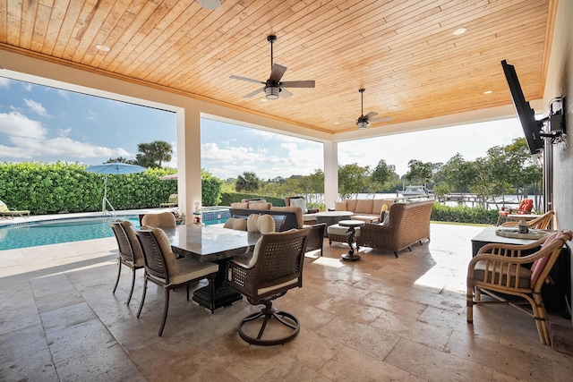 view of patio featuring a fenced in pool, an outdoor hangout area, and ceiling fan