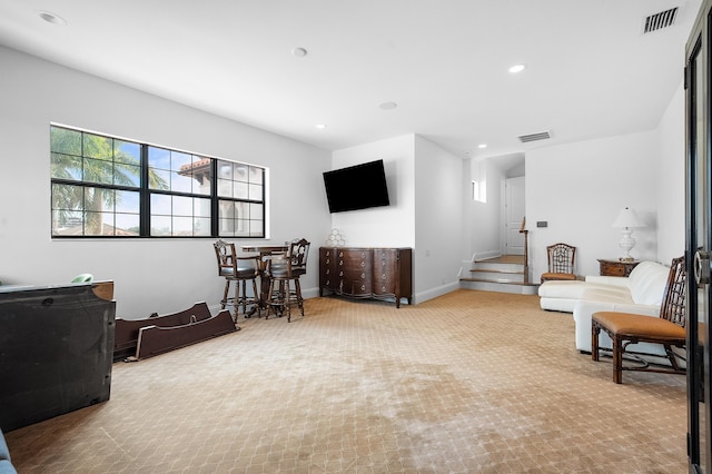 living room with light colored carpet