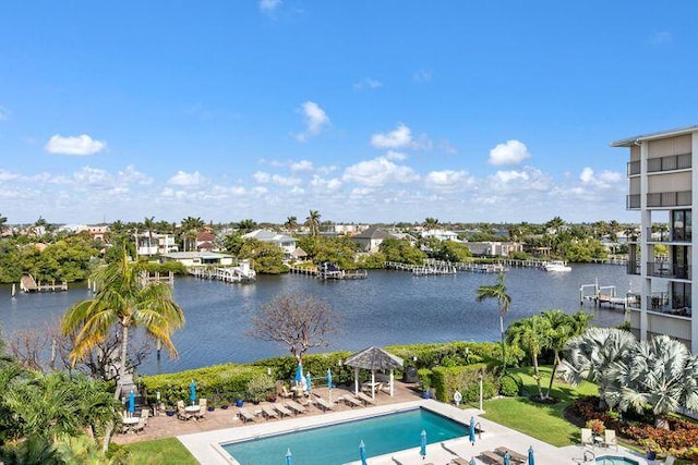 view of pool with a gazebo, a water view, and a patio area