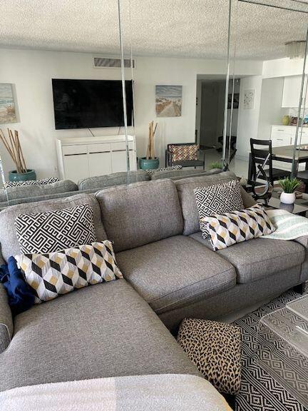 living room featuring a textured ceiling