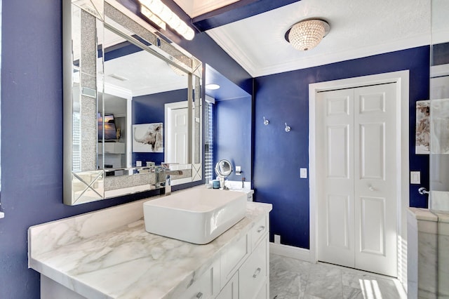 bathroom featuring vanity and crown molding