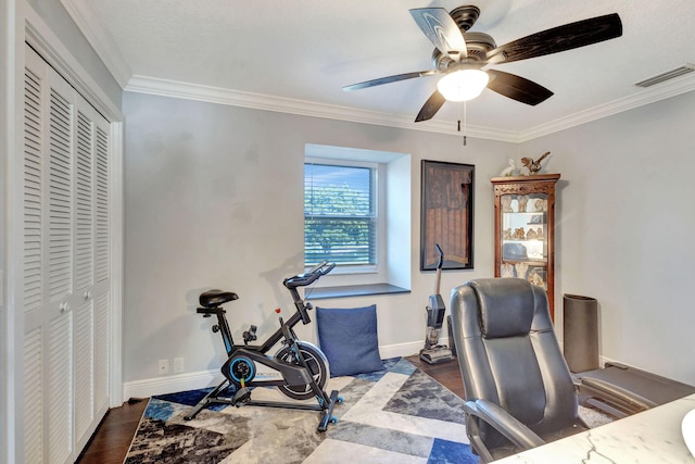 home office featuring crown molding, ceiling fan, and dark wood-type flooring