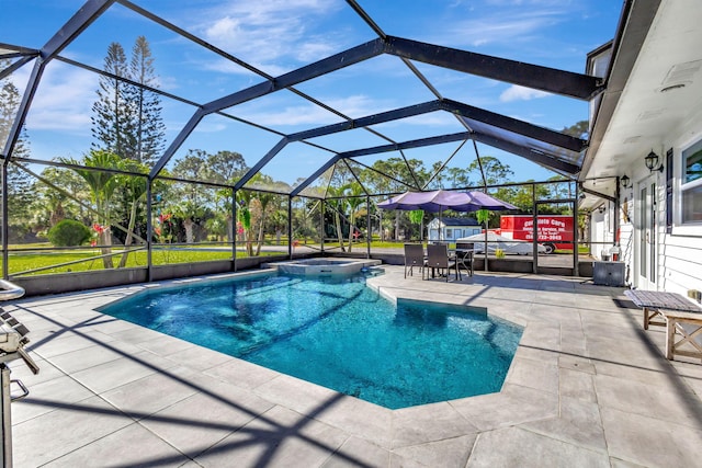 view of pool with an in ground hot tub, a lanai, and a patio