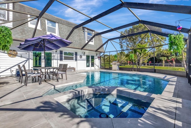 view of swimming pool featuring french doors, a lanai, an in ground hot tub, a grill, and a patio