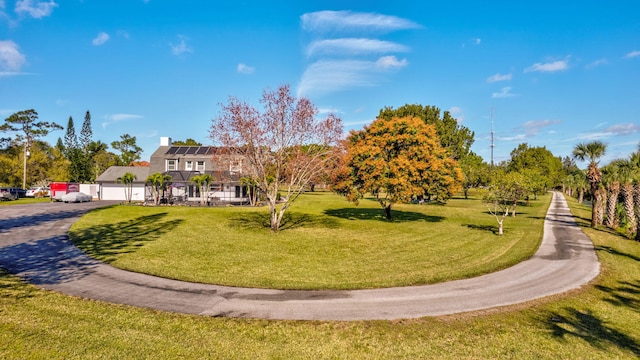 view of property's community featuring a yard