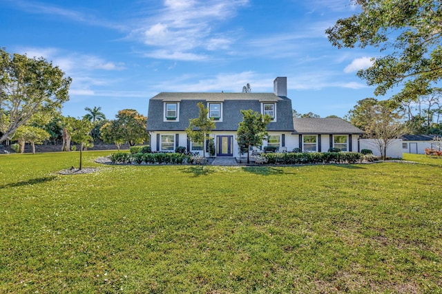 view of front of home featuring a front yard