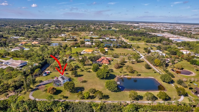 birds eye view of property with a water view