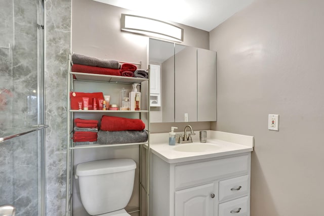 bathroom with vanity, toilet, and an enclosed shower