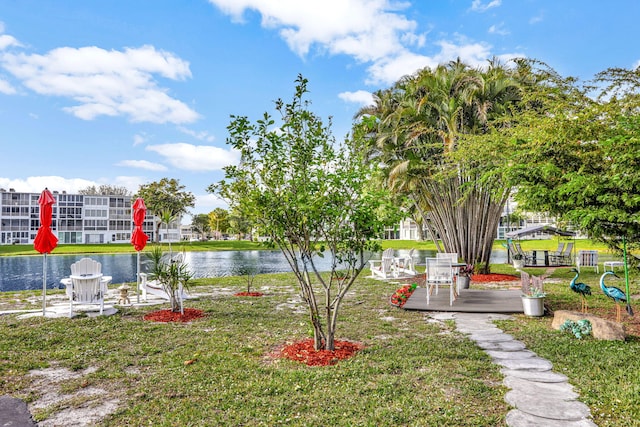 view of yard featuring a playground and a water view