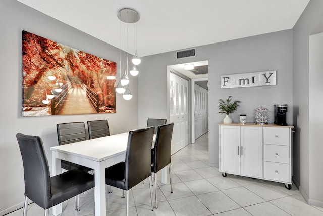 dining area with light tile patterned floors