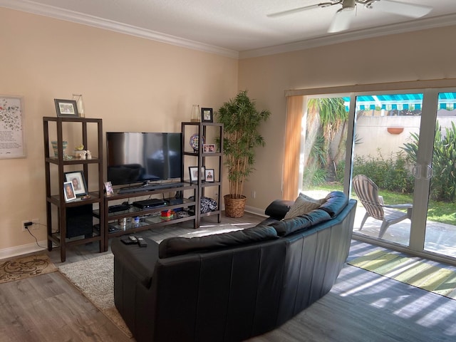 living room featuring crown molding, ceiling fan, and light hardwood / wood-style floors