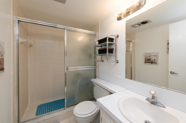 bathroom with vanity, toilet, and walk in shower