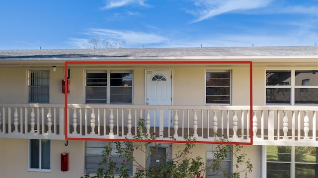 property entrance with a balcony