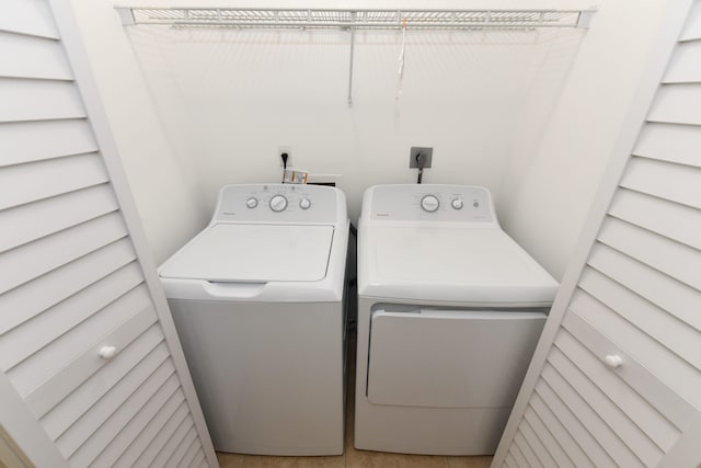 laundry area with independent washer and dryer