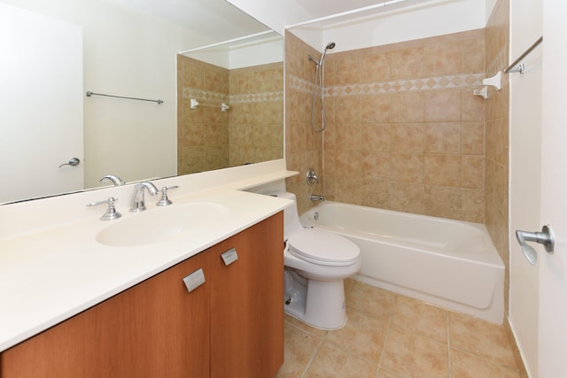 full bathroom featuring vanity, toilet, tiled shower / bath combo, and tile patterned flooring