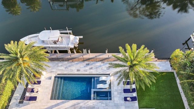 birds eye view of property with a water view