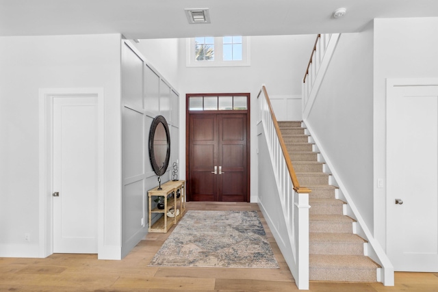 foyer with light hardwood / wood-style floors