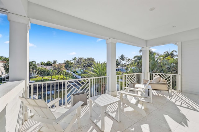 balcony featuring a water view