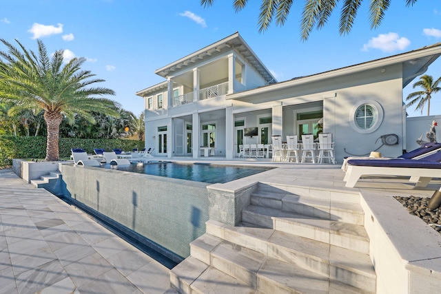 view of pool featuring a patio